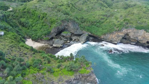 Aerial view of a private beach with white sand beaches and beautiful waves Stock Footage 239618591