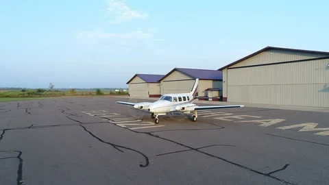 Aerial View of Private Jet Going from Hangar to Runway Stock Footage 100010723