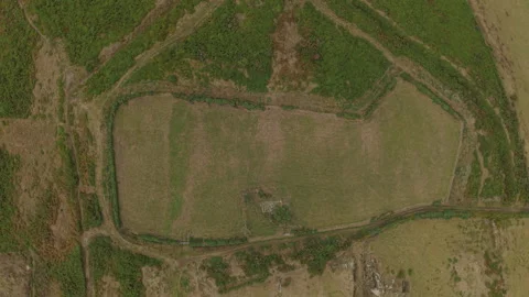 Aerial View Of Probable Iron Age Hillfort And Ancient Earthworks In Wales Stock Footage 344060025