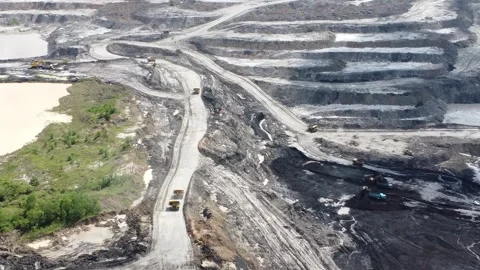 Aerial view of the process of loading and unloading trucks to build embankm.. Stock Footage 329401895