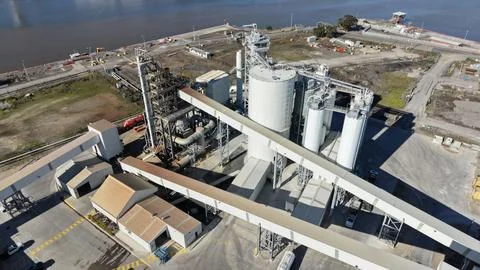 Aerial view processing plant cement silos conveyors Stock Photos