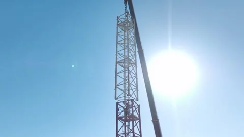 Aerial View: Professional crane assembly as the operator climbs high ladders and Vídeo Stock 296021133