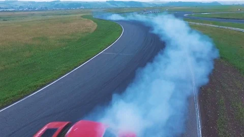 Aerial view of a professional driver drifting car on asphalt track Stock Footage 78155868