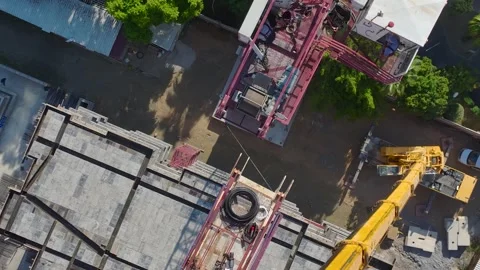 Aerial View: Professional operator assembles components carefully while scaling Vídeo Stock 296026009