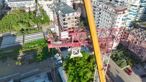 Aerial View: Professional operator scales ladders and assembles components Vídeo Stock 296024121