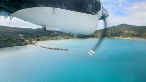 Aerial view propeller airplane window tropical island Kadavu Fiji, South Видео 345052792