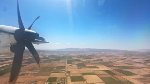 Aerial View of Propeller Plane Over Moroccan Farmland and Agricultural Fields Stock Footage 304989361