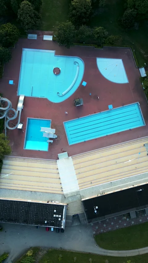 Aerial view of public pool surrounded by greenery, Germany. Stock Footage 284857942