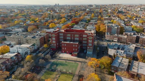 Aerial view of public school building in Borough Park Brooklyn, ProRes 422HQ Stock Footage 331349461