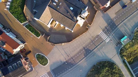 Aerial view of public square with red tiled roof buildings central triangular Stock Footage 318029751