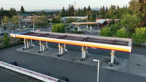 Aerial view pulling away from a vacant gas station in America. Stock Footage 246255646