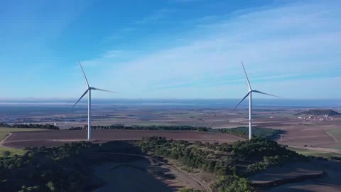 Aerial View Pulling Back from a Wind Turbine Stock Footage 323923586