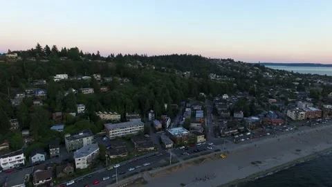 Aerial view pulling out towards the water of the Alki Beach community. Stock Footage 172491781