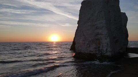 Aerial view push in shot passing cliffs out to sea at Botany Bay beach Stock Footage 234402665
