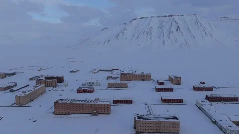 Aerial view of Pyramiden ghost town in the snow, Svalbard and Jan Mayen. Stock Footage 346399069