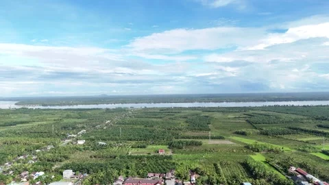 Aerial view of a quarry lake surrounded by lush greenery and mountains Stock Footage 334646714