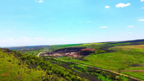 Aerial view of quarry pit among green hills, Bulgaria Stock-Footage 345153562