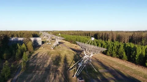 Aerial view of radio telescope array searching for signals Stock-Footage 334029844