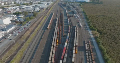Aerial view of rail yard with freight cars. PENROSE, AUCKLAND, NZ Stock-Footage 296036685