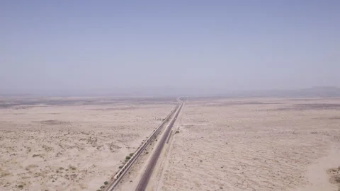 Aerial view of the railway and train cars going in to Marathon, Texas in west Stock Footage 309848428