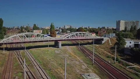 Aerial view of the railway bridge on the background of the railway in the Stock Footage 80871795