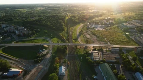Aerial View of Railway Intersection at Sunset with Mixed Land Use Stock Footage 296511295