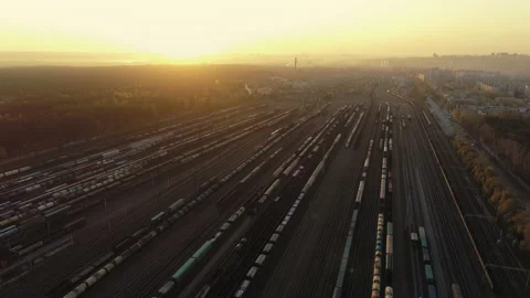 Aerial view. Railway sorting station at sunset. Many wagons and railway tracks Stock Footage 133482712