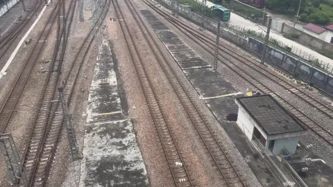 Aerial view of railway tracks at train station. Stockbeeldmateriaal 338092863