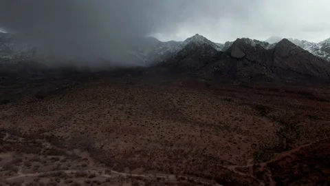 Aerial View of Rain Cloud and Snow in Arizona Desert Mountain Range 4K Stock Footage 154221697