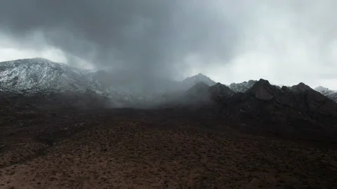Aerial View of Rain Cloud in Snow Covered Arizona Desert Mountain 4K Stock Footage 154208313