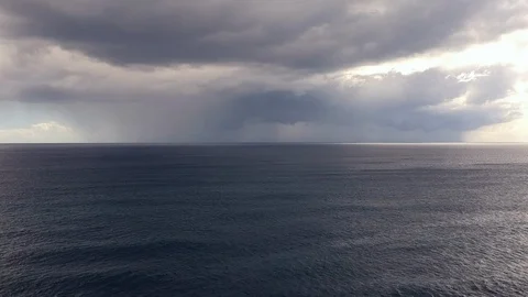 Aerial view of Rain Clouds and Light Rain over Caribbean Sea Stock Footage 102907550