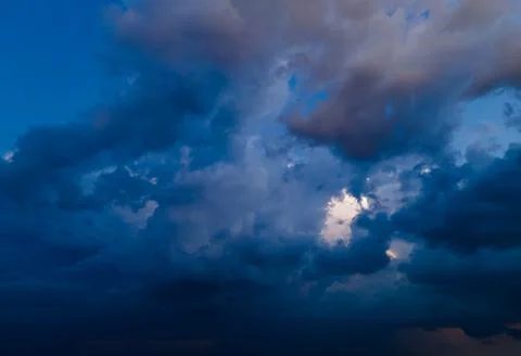 Aerial view on rain clouds at sunset over the city Foto stock