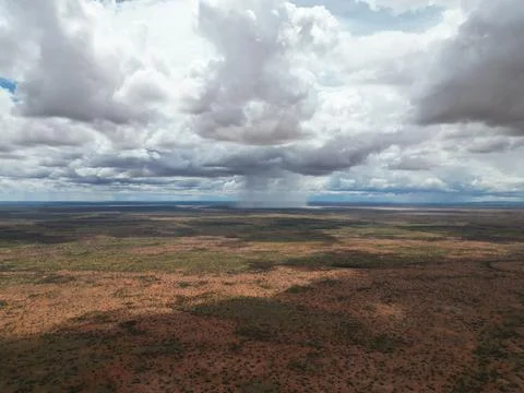 Aerial view of a rain patch into a vast plain landscape Stock-Fotos