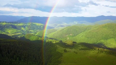 Aerial view of rainbow and rain in the mountains Video stock 111439508