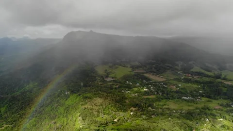 Aerial view of rainbow clouds mountains in Mauritius Stock Footage 170184671