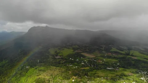 Aerial view of rainbow clouds mountains in Mauritius Stock Footage 170184711
