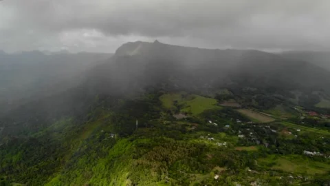 Aerial view of rainbow clouds mountains in Mauritius Stock Footage 170184734