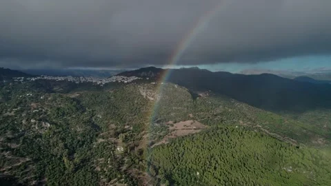 Aerial view rainbow in the mountains after the rain old city on background Stock Footage 231217110