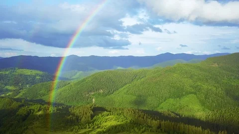 Aerial view of rainbow in the mountains Video stock 116991830