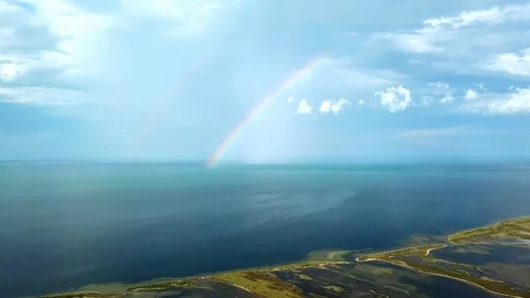 Aerial view of rainbow over seaaerial view of Rainbow above the sea and island Video stock 120085640