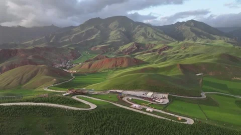 Aerial view of Rapeseed Fields in Qilian Mountains, Qilian, Qinghai, China Vídeos de archivo 307169339