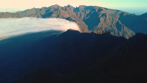 Aerial view of rare cloud waterfall flowing over Sao Vicente, Madeira Vídeos de archivo 328639535