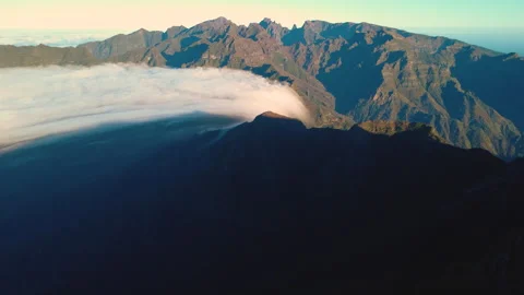 Aerial view of rare cloud waterfall flowing over Sao Vicente, Madeira Vídeos de archivo 328639648