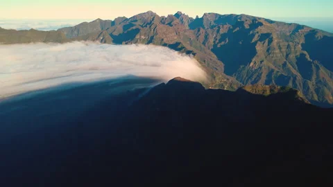 Aerial view of rare cloud waterfall flowing over Sao Vicente, Madeira Video stock 328639654