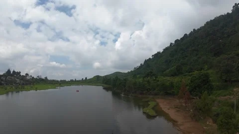Aerial view of Rawa Gede Jonggol Lake and green hills, Indonesia. Stock Footage 336380875