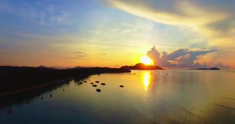 Aerial view The rays of the sun shine through the clouds at beautiful sunset. Stock Footage 246421463