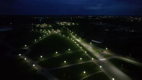 Aerial view of a recreation area with paths and rows of burning lanterns and a 库存影片 221073809