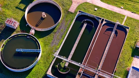Aerial view of rectangular and circular water treatment basins Stockbeeldmateriaal 329622333