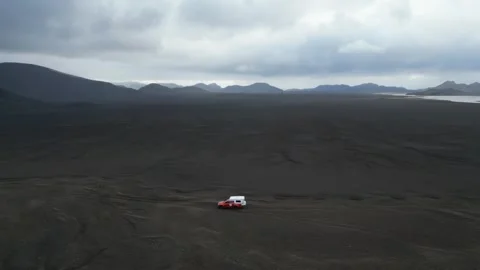 Aerial view of red camper in volcanic landscape, Iceland. Stock Footage 339751689
