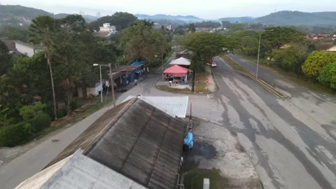 Aerial view of red car moving and car wash in Kajang Stock Footage 150748640